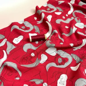 Faces on Red Viscose Fabric